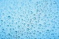 Drops of rain on the window glass. Shallow DOF. Window after rain. Blue Water background with water drops Royalty Free Stock Photo