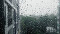 Drops of rain on a window pane, Torrential rain day Royalty Free Stock Photo