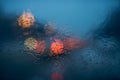 Drops Of Rain On Windshield. Street Bokeh Lights Out Of Focus Royalty Free Stock Photo