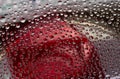 Drops of red liquid flow down on the motley mirror ice surface. Royalty Free Stock Photo