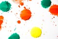 Drops of red, yellow and green paint are sprayed on a white background Royalty Free Stock Photo
