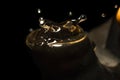 Drops from a spout of clay antique tea pot macro