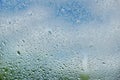 drops of summer rain on the window glass of fresh blue and white Royalty Free Stock Photo