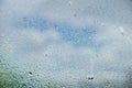 drops of summer rain on the window glass of fresh blue and white Royalty Free Stock Photo