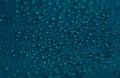 Drops texture. Wet water bubble pattern on blue glass background. Royalty Free Stock Photo