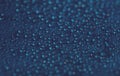 Drops texture. Wet water bubble pattern on blue glass background. Royalty Free Stock Photo