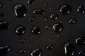 Drops of water on a black matte surface Royalty Free Stock Photo