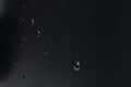 Drops of water on a black surface, background Royalty Free Stock Photo