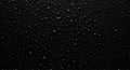 Drops of water on a black surface. The condensate. Top view. Free space Royalty Free Stock Photo