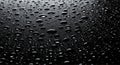 Drops of water on a black surface. The condensate. Top view. Free space Royalty Free Stock Photo