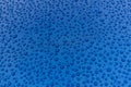 Drops of water on a blue metal surface. Royalty Free Stock Photo