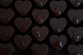 Drops of water on chocolate hearts, baking trays