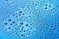 Drops of water on a color background. Light blue Royalty Free Stock Photo