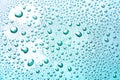 Drops of water on a color background. Light blue Royalty Free Stock Photo