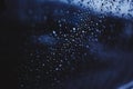 Drops of water on the glass. rain outside the window. blue texture background. cloudy rainy day Royalty Free Stock Photo