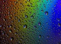 Drops of water on the glass, with the reflection of the rainbow Royalty Free Stock Photo