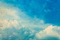 Drops of water on glass window over blue sky. Royalty Free Stock Photo