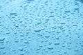 Drops of water on a light blue surface Royalty Free Stock Photo