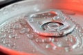 Drops of water on pop can closeup in red light Royalty Free Stock Photo