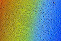 Drops of water on a rainbow background Royalty Free Stock Photo