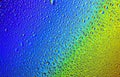 Drops of water on a rainbow background. Royalty Free Stock Photo