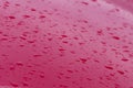 Drops of water on the red car roof, nature background Royalty Free Stock Photo