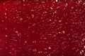 Drops of water on a red color background Royalty Free Stock Photo