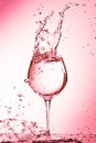 drops of water splashing in a wine glass Royalty Free Stock Photo