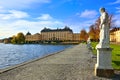 Drottningholm Palace, Swedens royal residence and statue lined lake during autumn Royalty Free Stock Photo