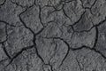 Drought. Cracks in the dry ground. Natural grey background Royalty Free Stock Photo