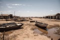 drought-stricken town, with dried up lake and empty boats