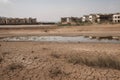 drought-stricken town, with empty reservoirs and dry rivers