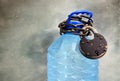 Drought and water scarcity concept with plastic bottle with fresh water, chain and lock. Great value of water idea. Royalty Free Stock Photo