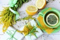 Droup of yellow and green fruit and plants on white wooden background Royalty Free Stock Photo