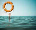 Drown man with rised hand getting lifebuoy help in sea Royalty Free Stock Photo