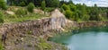 Drowned in flooded basalt querrie excavator Royalty Free Stock Photo