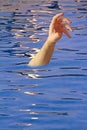 Drowning arm in swimming pool