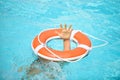 Drowning kid. Helping lifebuoy with hands in the water. Life buoy survive. Support survival or save, Concept of help Royalty Free Stock Photo