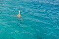 Drowning man in sea asking for help with raised arms. The man is drowning in the sea. man drowning in the sea and waving hand for Royalty Free Stock Photo