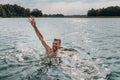 Drowning man. Sticking hand out of water Royalty Free Stock Photo