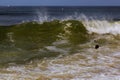 Drowning man trying to swim out of the ocean filtered Royalty Free Stock Photo