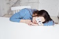 Drowsiness and procrastination. A student pretends to work,