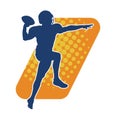 Silhouette of a male american football athlete in action pose. Royalty Free Stock Photo