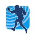 Silhouette of a male american football athlete in action pose. Royalty Free Stock Photo