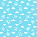 Seamless pattern with white clouds, sun and baby feet on blue background Royalty Free Stock Photo