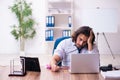 Drug addicted male employee working in the office Royalty Free Stock Photo