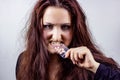 Drug addicted unhealthy depressed young woman in black with different pills in hand. Depression, drugs abuse