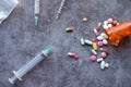 Drug addiction concept with heroine packet and syringe on black backgrund Royalty Free Stock Photo