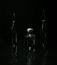 The drug is in ampoules. Injection medications on a black background in reflection