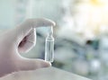 Drug ampule in workers hand Royalty Free Stock Photo